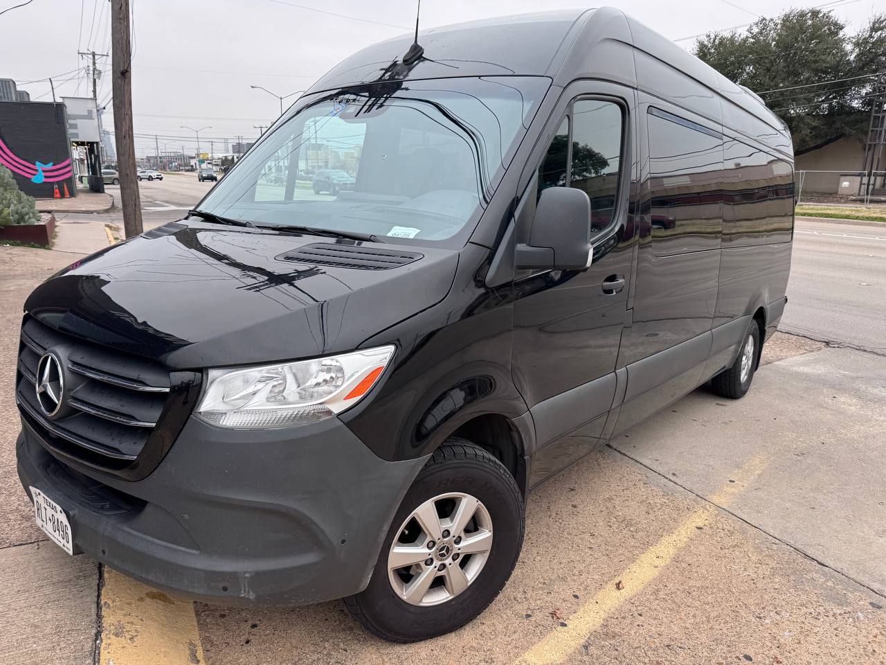 15-seater black Sprinter van rear view available in Dallas, Fort Worth
