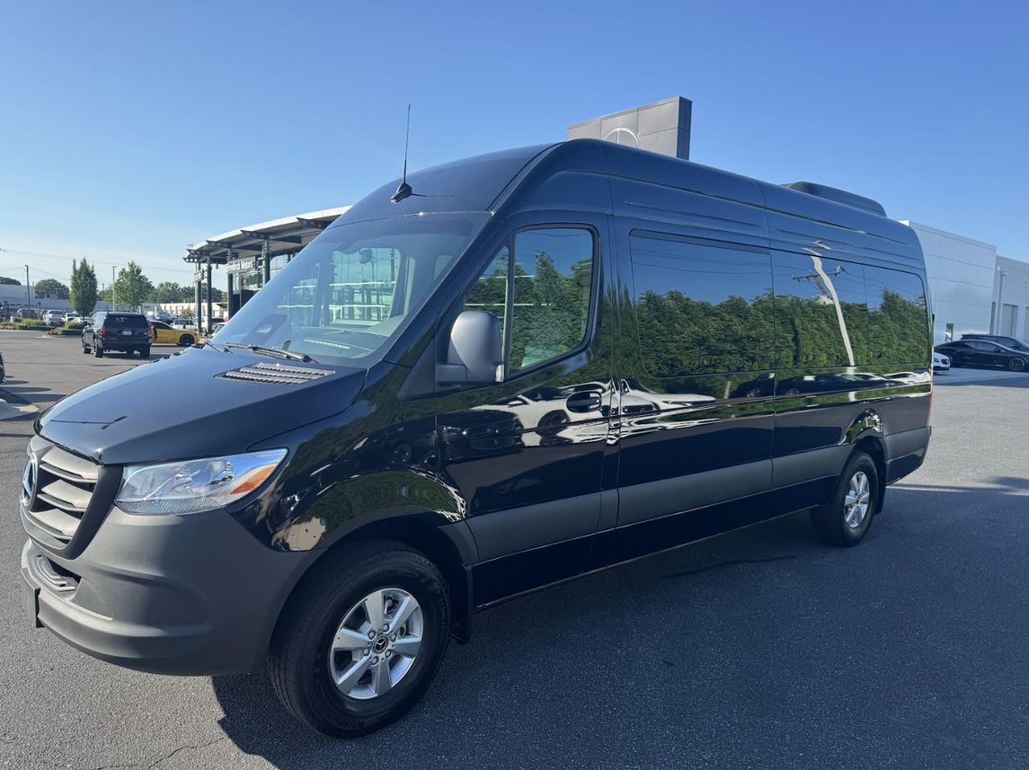 12-15 seater black Sprinter van exterior front view in Charlotte, NC