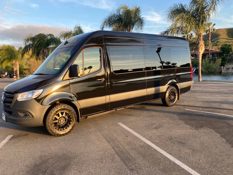 Black Sprinter van side profile for group travel in Los Angeles
