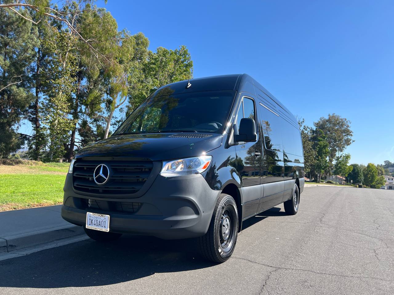Black 15-seater Mercedes Sprinter passenger van rear view — Orange County van rental near John Wayne Airport