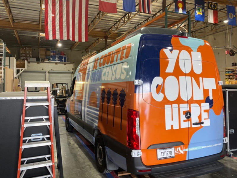 Sprinter van wrap used for mobile advertising with bold graphics and branding