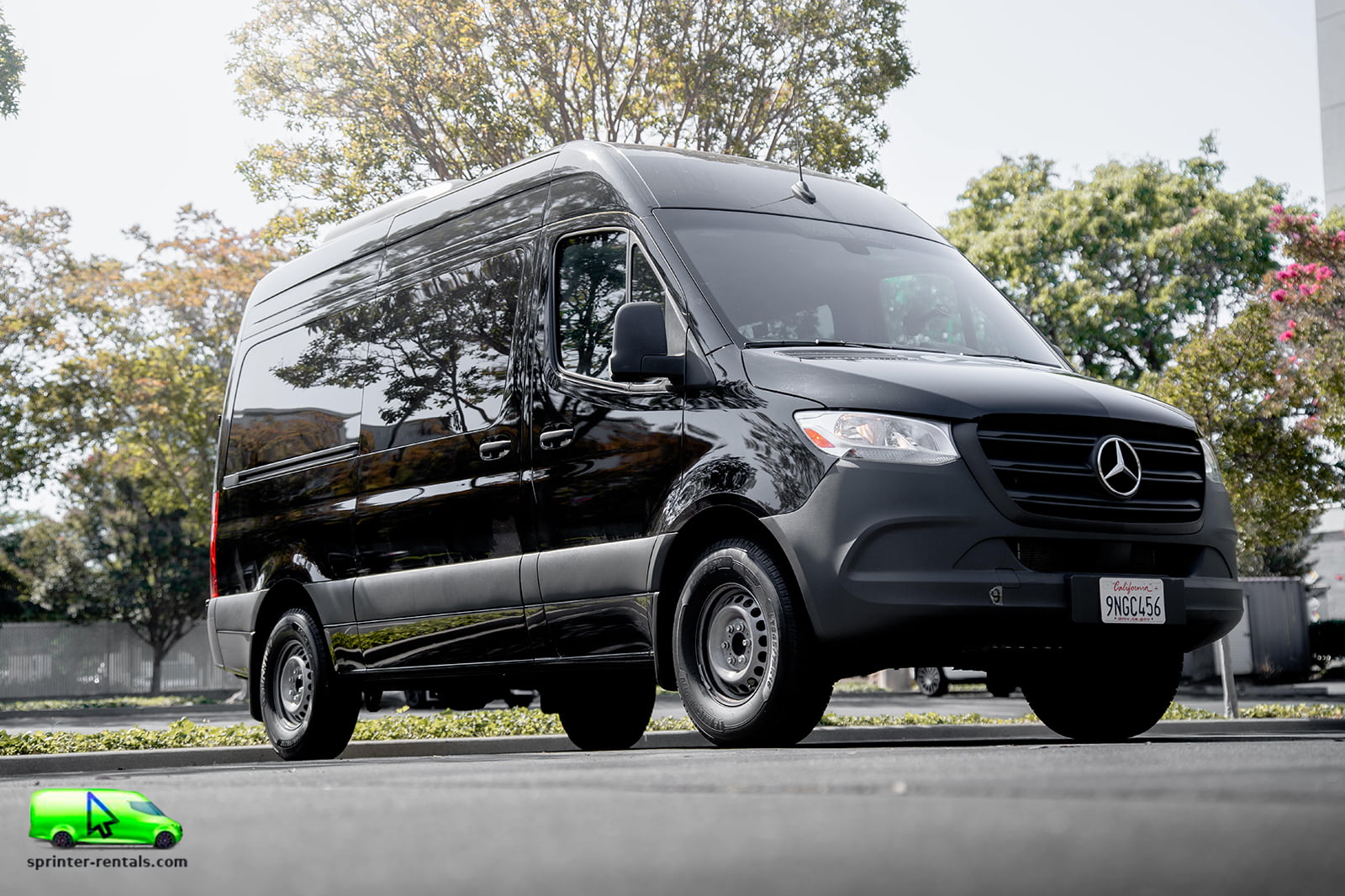 Exterior view of a 12 seater Mercedes Sprinter van available for rental