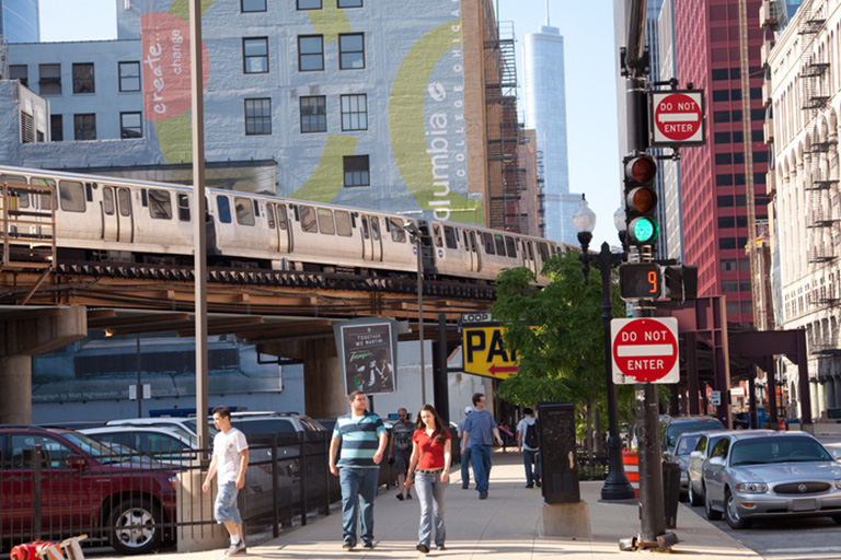 Chicago Sprinter van parking under train tracks